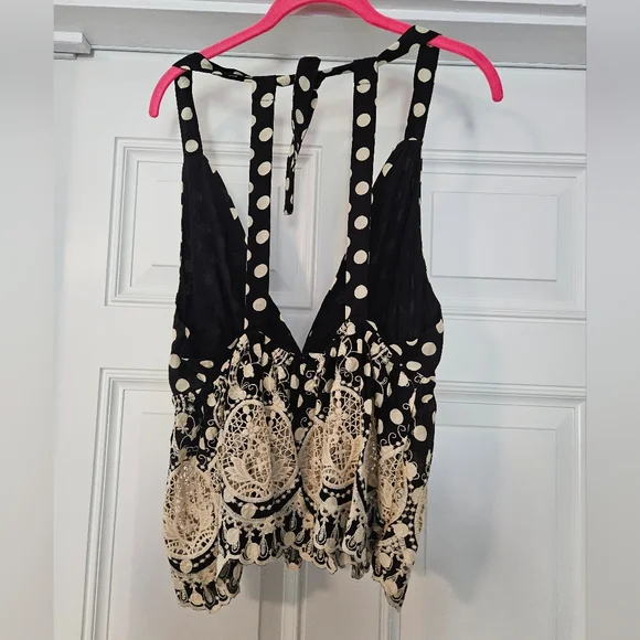Free people top size XS. Black w cream Polkadots.          A - Picture 3 of 6